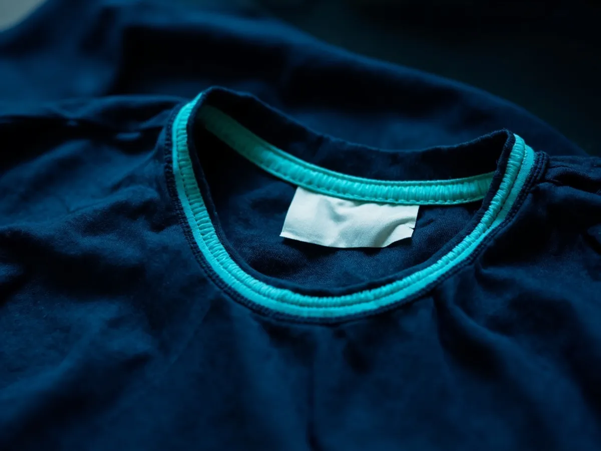 Inner neck tag of a football shirt with plain fabric