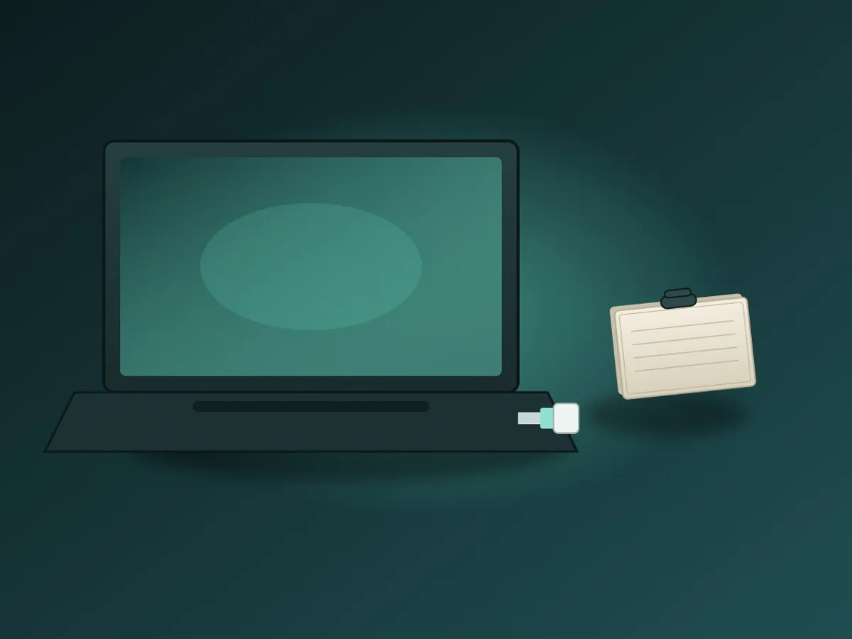 A USB drive plugged into a laptop beside a small stack of blank index cards, standing for exporting records before migrating