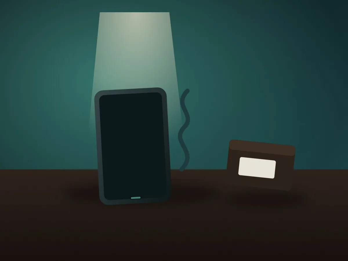 Inspecting a phone's charging port with a small flashlight next to its charging cable