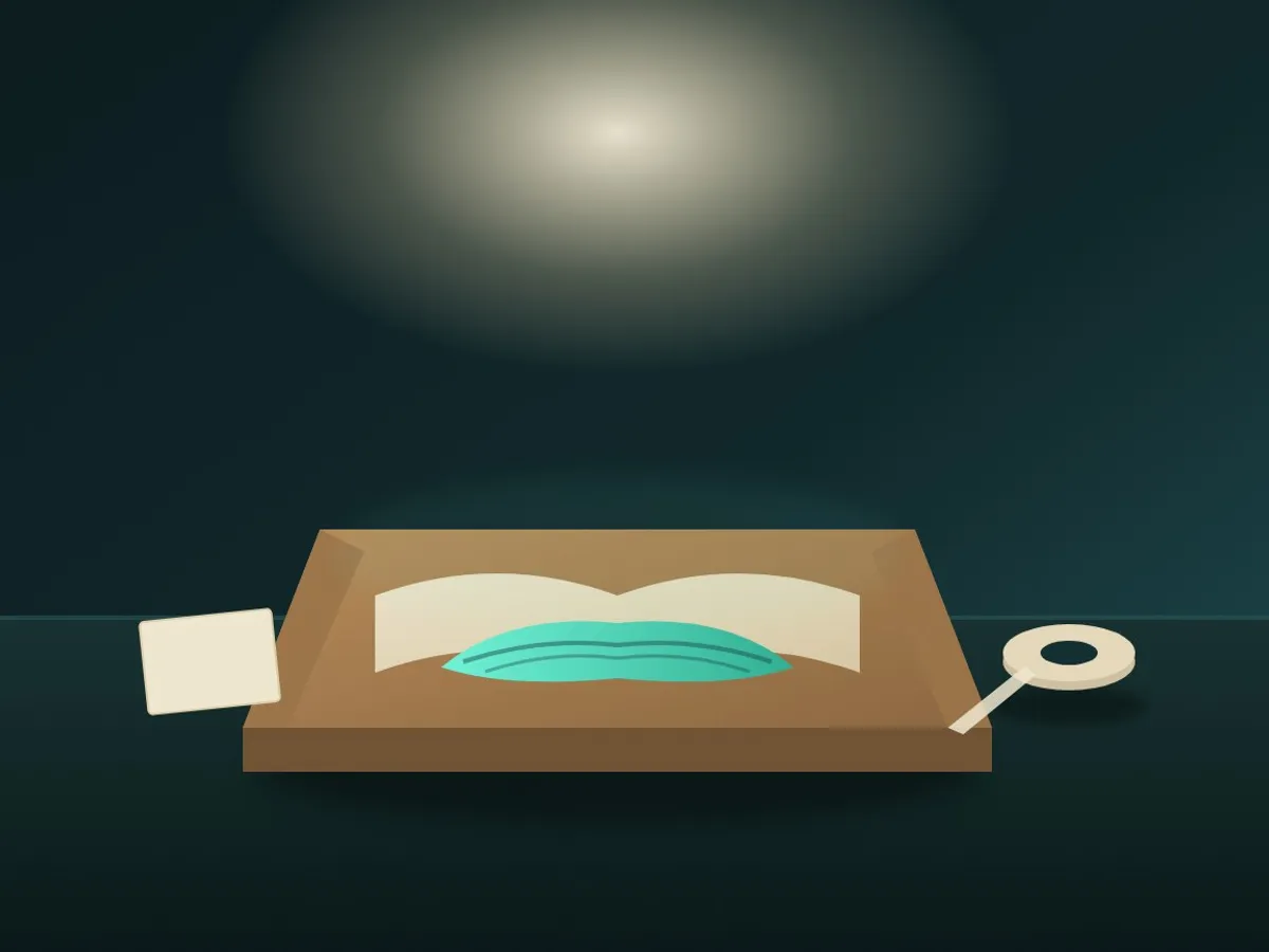 a small open mailer box with a folded scarf and tissue paper, tape roll beside it, being packed for shipping
