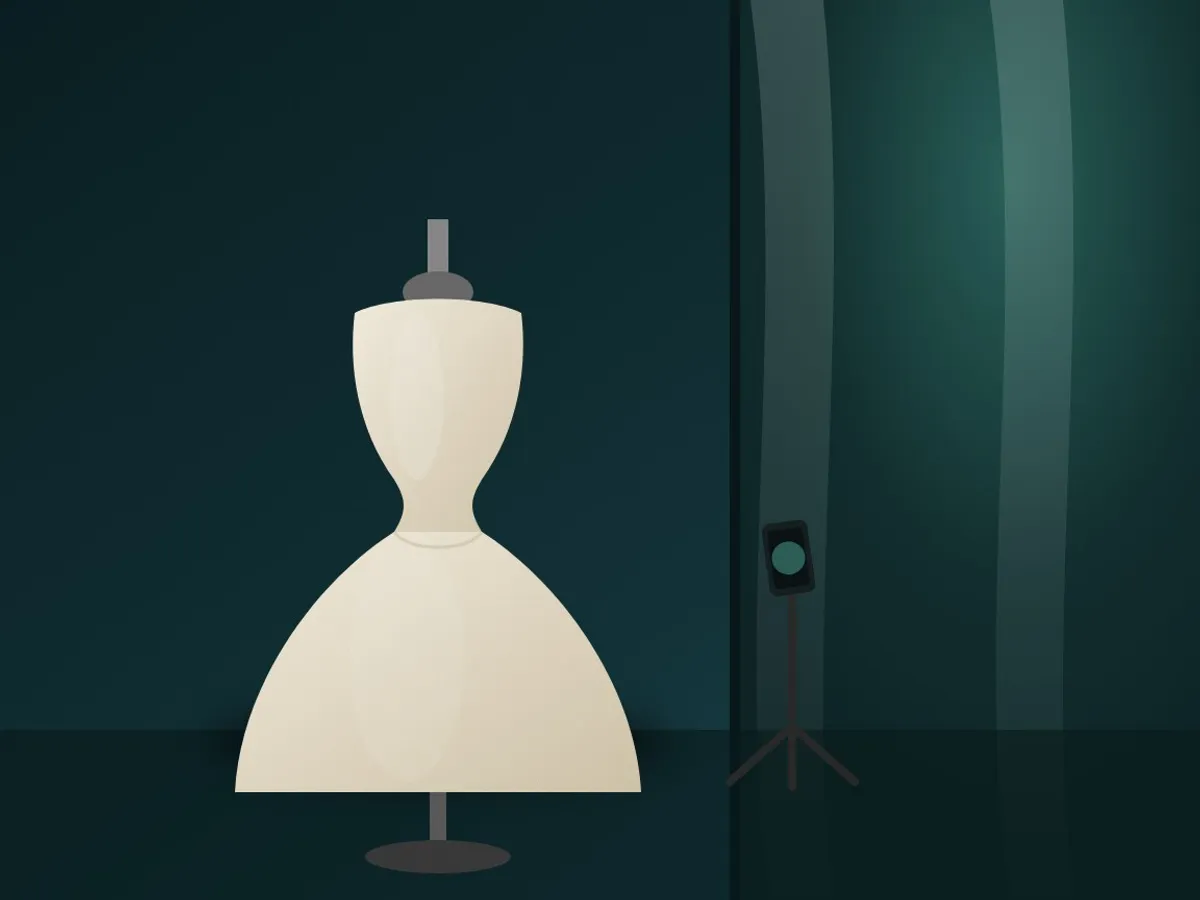 A wedding dress on a dress form being photographed near a window