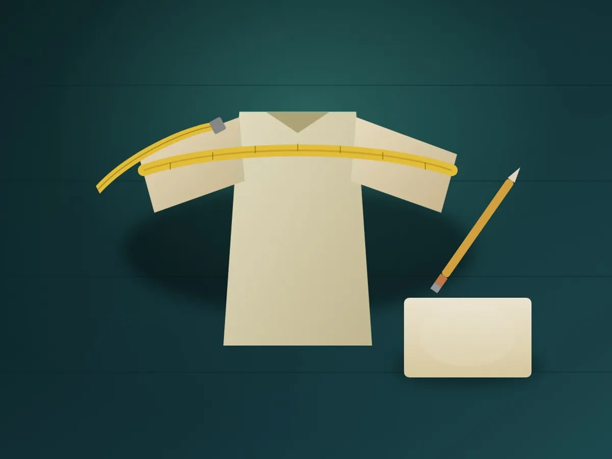 A flat-laid shirt with a tape measure across the chest and along the sleeve, a notepad beside it